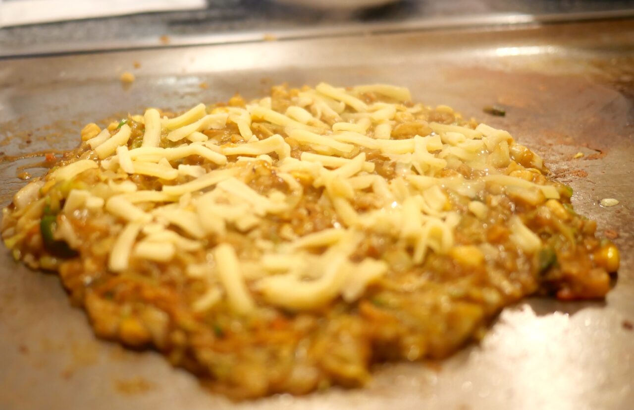 仕上げのチーズ